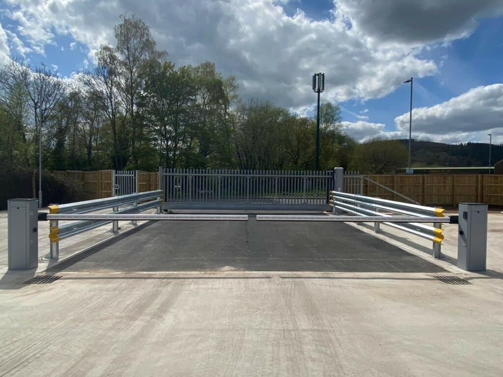 Heavy-duty traffic barriers installed to prevent unauthorised vehicle access to industrial sites, enhancing security and safety